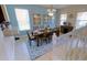 Bright dining room with a large table and beautiful decor, perfect for Gathering meals and entertaining at 4405 Acorn Ct, Davenport, FL 33837