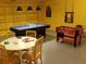 Spacious game room featuring ping pong, foosball, a table with chairs and yellow walls at 4405 Acorn Ct, Davenport, FL 33837