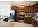 Well-equipped kitchen featuring stainless steel appliances, granite countertops, and ample cabinet space at 4405 Acorn Ct, Davenport, FL 33837