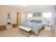 Serene main bedroom with a comfortable king bed, carpet flooring, and ample natural light at 4405 Acorn Ct, Davenport, FL 33837