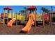 Community playground with two slides and a spiral staircase at 4405 Acorn Ct, Davenport, FL 33837