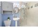 Bathroom featuring pedestal sink, glass shower, and blue walls at 4700 Larado Pl, Orlando, FL 32812