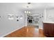 Bright dining area with hardwood floors offering a view of the fireplace room at 4700 Larado Pl, Orlando, FL 32812