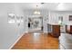 Elegant dining area with hardwood floors and a view of the fireplace room at 4700 Larado Pl, Orlando, FL 32812