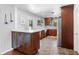 Charming kitchen featuring granite countertops, stainless steel appliances, and custom wood cabinetry at 4700 Larado Pl, Orlando, FL 32812