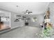 Open living room with fireplace, shelving, and plush carpeting at 4700 Larado Pl, Orlando, FL 32812