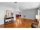 Bright living room showcasing hardwood floors, a decorative table, and an open layout at 4700 Larado Pl, Orlando, FL 32812