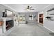 Bright living room featuring a painted fireplace, and easy kitchen access at 4700 Larado Pl, Orlando, FL 32812