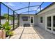 View of the screened-in pool with outdoor seating and well-maintained stone pavers at 4700 Larado Pl, Orlando, FL 32812