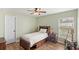 Bright bedroom with hardwood floors, a ceiling fan and a window with blinds at 508 Yellow Submarine Ct, Groveland, FL 34736