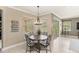 Cozy breakfast nook with a round table, comfortable chairs, and natural light with views to outside at 508 Yellow Submarine Ct, Groveland, FL 34736