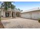 Desirable home featuring a large driveway, three-car garage, and inviting front porch at 508 Yellow Submarine Ct, Groveland, FL 34736