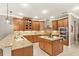Well-equipped kitchen featuring granite countertops, stainless appliances, and an efficient central island at 508 Yellow Submarine Ct, Groveland, FL 34736