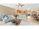 Bright and open living area seamlessly connects to the kitchen and breakfast nook, and backyard at 508 Yellow Submarine Ct, Groveland, FL 34736
