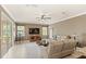 Inviting living room with plenty of natural light, neutral tones, and comfortable couches and furniture at 508 Yellow Submarine Ct, Groveland, FL 34736