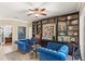 Inviting living room featuring custom built-ins, comfortable seating, and neutral tones at 508 Yellow Submarine Ct, Groveland, FL 34736