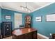 Well-lit office features a large desk, leather chair, wooden floors, a safe and modern lighting at 508 Yellow Submarine Ct, Groveland, FL 34736