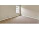 Neutral bedroom with carpet flooring, natural light, and ample space for furniture at 536 Talisi Loop, St Cloud, FL 34771