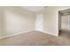Bright bedroom featuring neutral carpet, walls, a closet and natural light at 536 Talisi Loop, St Cloud, FL 34771