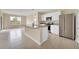 Open kitchen features stainless steel appliances, granite countertops, and tile flooring at 536 Talisi Loop, St Cloud, FL 34771