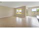 Bright living room with tile floors, large windows, and sliding glass door at 536 Talisi Loop, St Cloud, FL 34771
