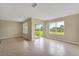 Spacious, brightly lit living area with tile floors and sliding glass doors to the yard at 536 Talisi Loop, St Cloud, FL 34771