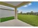 Covered patio featuring concrete floor and views of the yard, fence and sky at 536 Talisi Loop, St Cloud, FL 34771