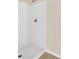 Bright and modern white shower featuring an adjustable shower head and built-in shelves at 536 Talisi Loop, St Cloud, FL 34771