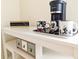 Close-up of a coffee station on a white shelf, decorated with charming Mickey Mouse mugs at 626 Verona Ave, Davenport, FL 33897
