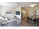 Bright and open living space with a dining area and staircase, perfect for entertaining at 626 Verona Ave, Davenport, FL 33897