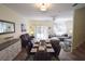 Open-concept living and dining area with stylish furnishings and natural light creates an inviting space at 626 Verona Ave, Davenport, FL 33897