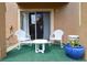 Cozy patio area with a table and chairs, perfect for relaxing outdoors at 626 Verona Ave, Davenport, FL 33897