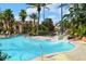 Resort-style pool with a water slide and ample seating for relaxation and fun at 626 Verona Ave, Davenport, FL 33897