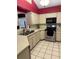 Bright kitchen featuring stainless steel appliances, white cabinetry, and plenty of counter space at 6518 Garden Spring Ct, Orlando, FL 32818