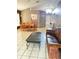 Spacious living room featuring tiled floors, a ceiling fan, and sliding glass doors to the backyard at 6518 Garden Spring Ct, Orlando, FL 32818