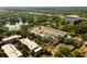 Aerial view displaying the property's desirable location near a lake and lush green surroundings at 654 Mariposa St, Orlando, FL 32801