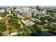 Aerial view showcases the property's prime location amidst lush greenery near a serene lake at 654 Mariposa St, Orlando, FL 32801