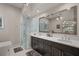 Luxurious bathroom with a walk-in shower, double vanity, and elegant fixtures at 654 Mariposa St, Orlando, FL 32801