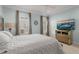 Serene bedroom with soft lighting, plush bedding, and a view of the city skyline at 654 Mariposa St, Orlando, FL 32801
