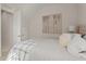 Bright bedroom with a large artwork and a view to the hallway at 654 Mariposa St, Orlando, FL 32801