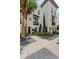 Charming three-story townhomes with manicured landscaping and decorative stone accents at 654 Mariposa St, Orlando, FL 32801