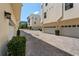 Well-maintained garages lining the driveway with manicured landscaping around the community at 654 Mariposa St, Orlando, FL 32801