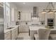 Well-appointed kitchen featuring a kitchen island, stainless steel appliances, and stone backsplash at 654 Mariposa St, Orlando, FL 32801
