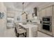 Bright kitchen featuring stone countertops, stainless steel appliances, and custom cabinetry at 654 Mariposa St, Orlando, FL 32801