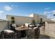 Inviting rooftop patio with stylish wicker furniture and a charming outdoor dining area under the blue sky at 654 Mariposa St, Orlando, FL 32801