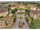 Aerial view of the complex showing manicured grounds, community pool, and fountains at 724 Terrace Ridge Cir # 724, Davenport, FL 33896