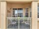 Cozy outdoor balcony with seating, perfect for relaxing and enjoying the fresh air at 724 Terrace Ridge Cir # 724, Davenport, FL 33896