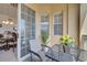 Cozy balcony view features seating, decor, and sliding door access to the dining area at 724 Terrace Ridge Cir # 724, Davenport, FL 33896