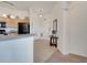 Welcoming entryway with neutral tones and tile flooring, complemented by a kitchen view at 724 Terrace Ridge Cir # 724, Davenport, FL 33896