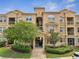 Charming condo building with manicured landscaping and a welcoming entrance at 724 Terrace Ridge Cir # 724, Davenport, FL 33896